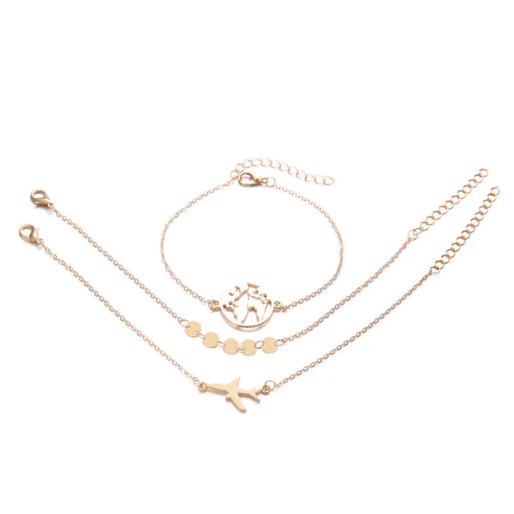 Three Bohemian-style bracelets with heart-shaped alloy charms featuring aircraft map designs