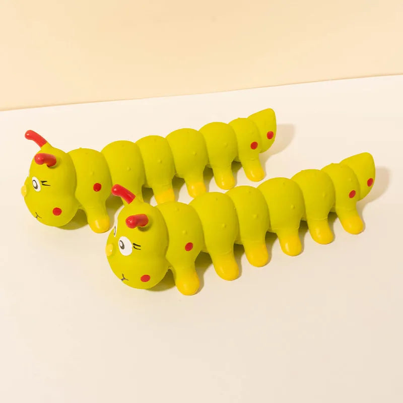 Yellow caterpillar rubber dog squeaky toy for small medium breeds on white background