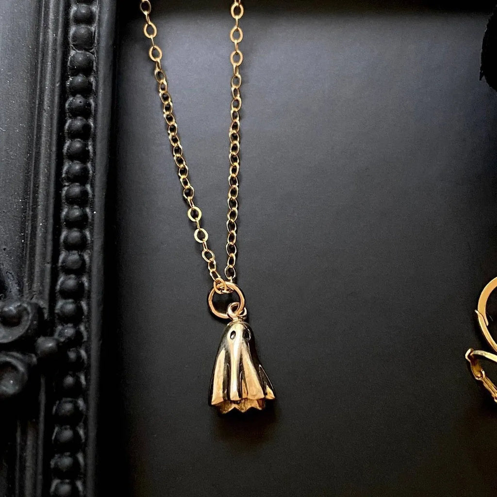 A titanium steel ghost pendant necklace on a choice of stainless steel chain styles.