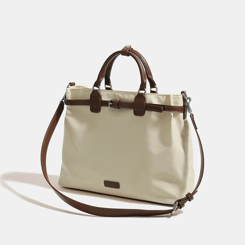 Women's nylon tote bag with organisation pockets in black colour showing internal compartments