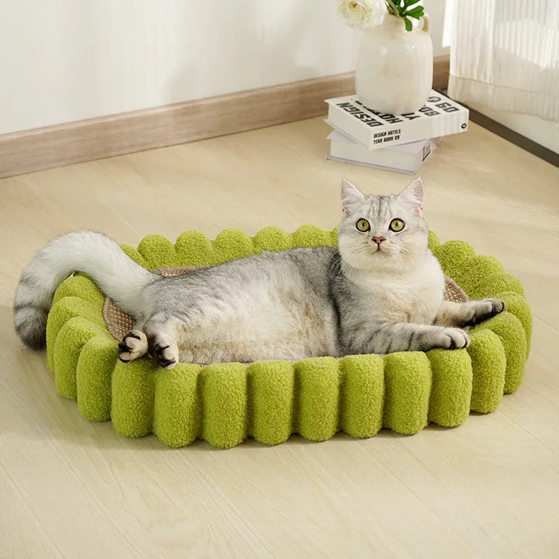 Green oval cat scratcher bed with sisal surface, showing bowl shape for scratching and sleeping