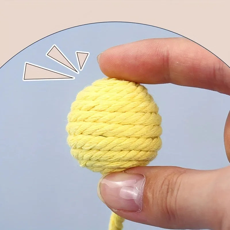 Colourful cat toy ball with a rope and built-in bell for interactive kitten play.