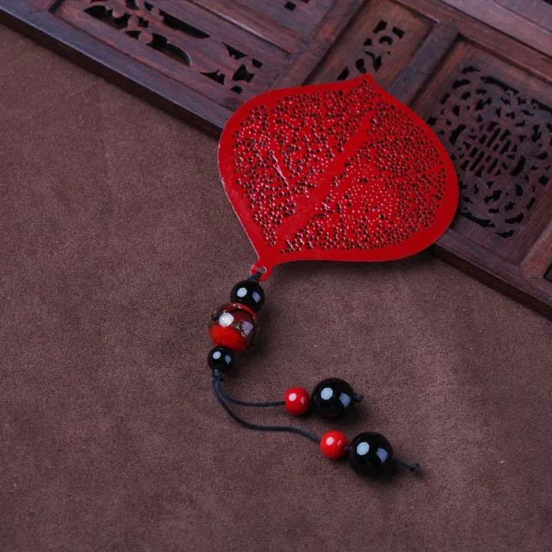 Brass metal hollow plated bookmark with leaf design and rose gold tassel