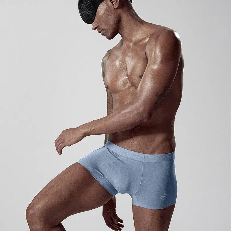 One-piece seamless modal men's underwear in a solid colour with a mid waist design.
