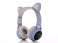 Pink cartoon cat ear wireless Bluetooth gaming headset displayed on a white background.