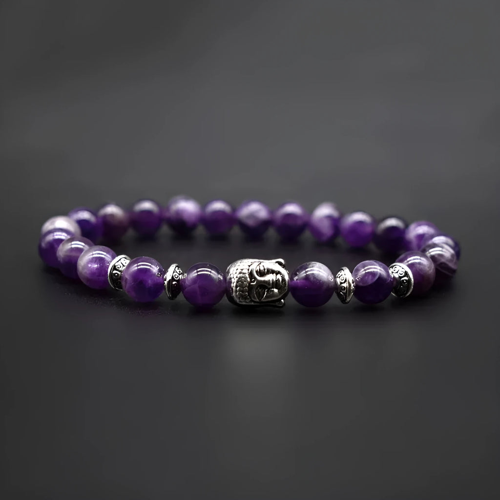 Close up of 19mm manual Tiger Eye bead with carved Buddha head on unisex bracelet