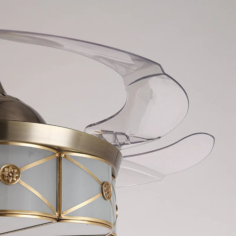 Gold 42-inch ceiling fan light with invisible blades and remote control on a white ceiling