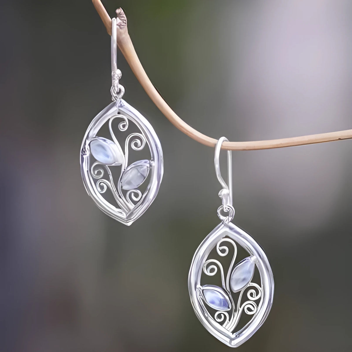 Silver leaf-shaped earrings with embedded colourful moonstone stones for women