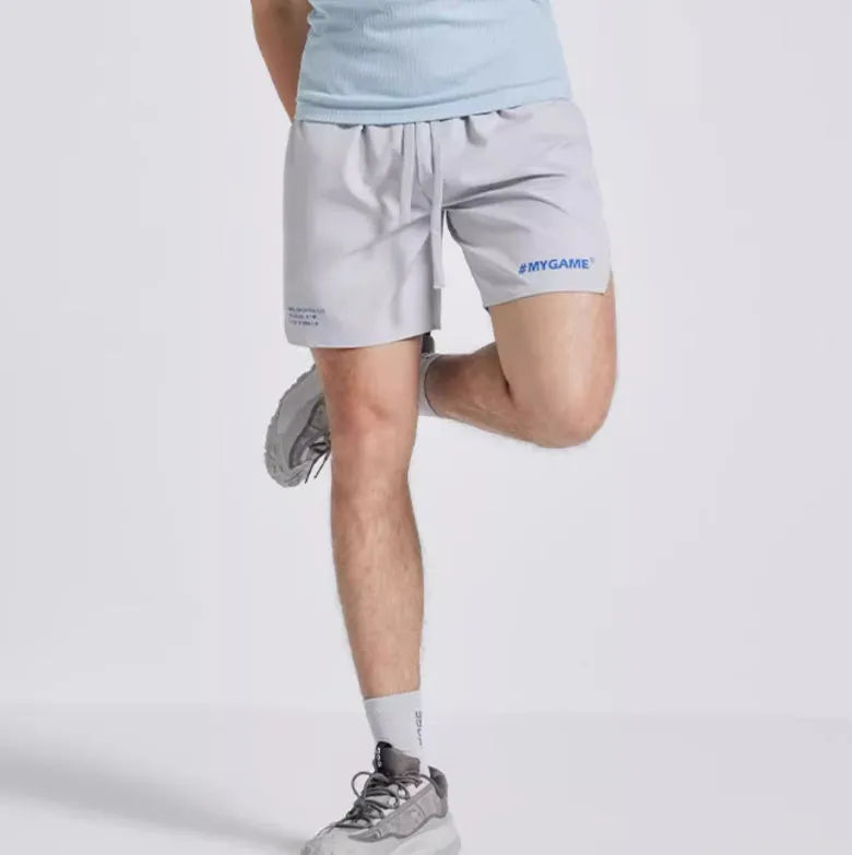 Men's blue training shorts with moisture-wicking fabric, shown from the side.