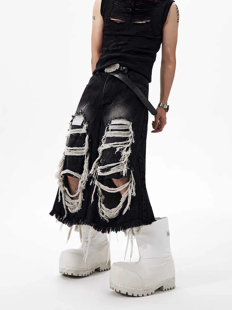 Women's black cropped wide leg jeans with mid-high waist and ripped patch detailing