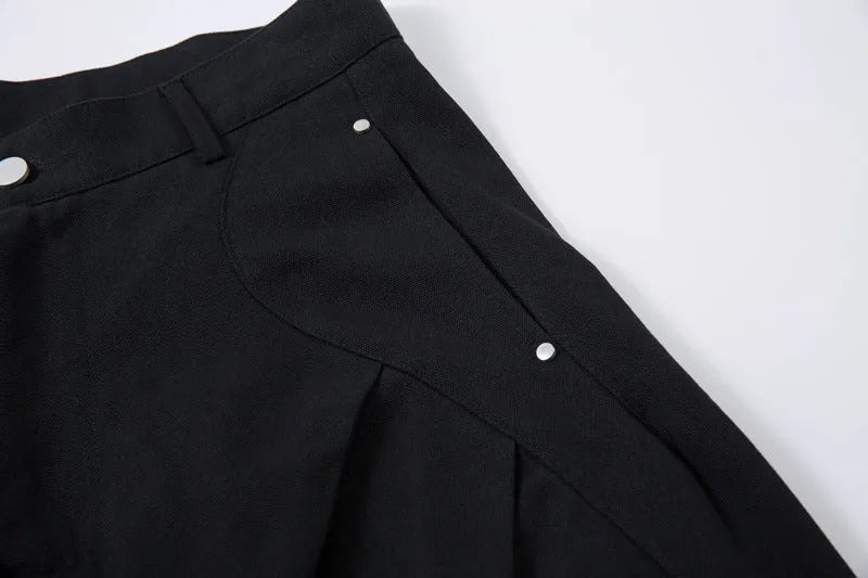Men's black pleated machete casual trousers with loose-fitting wide-leg design and cotton construction
