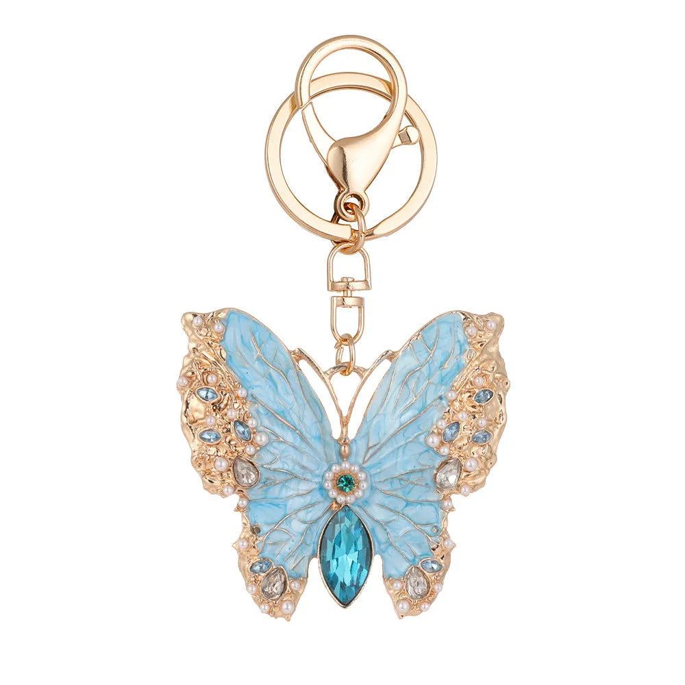 Enamel dripping oil butterfly brooch keychain in pink or blue, dual purpose European style metal accessory.