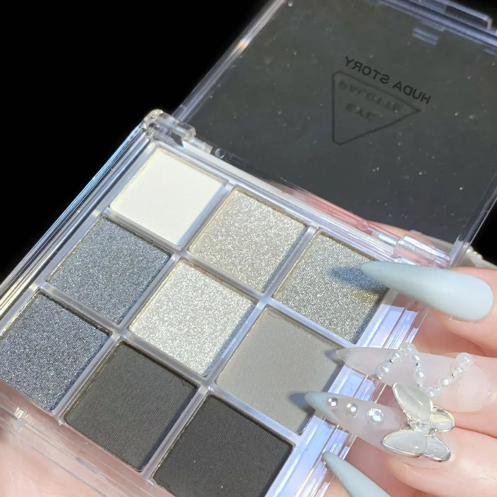 Smoked design nine-colour eye shadow palette showing white, silver, black, and iron grey shades