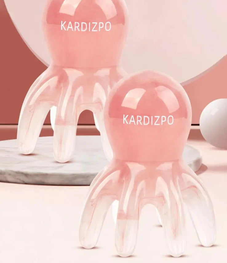 Pink natural resin octopus-shaped massage comb with storage bag.