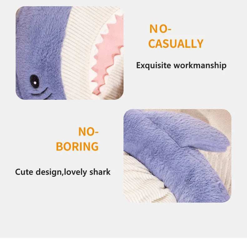 Blue shark pattern pet bed cushion for dogs or cats on a wooden floor.