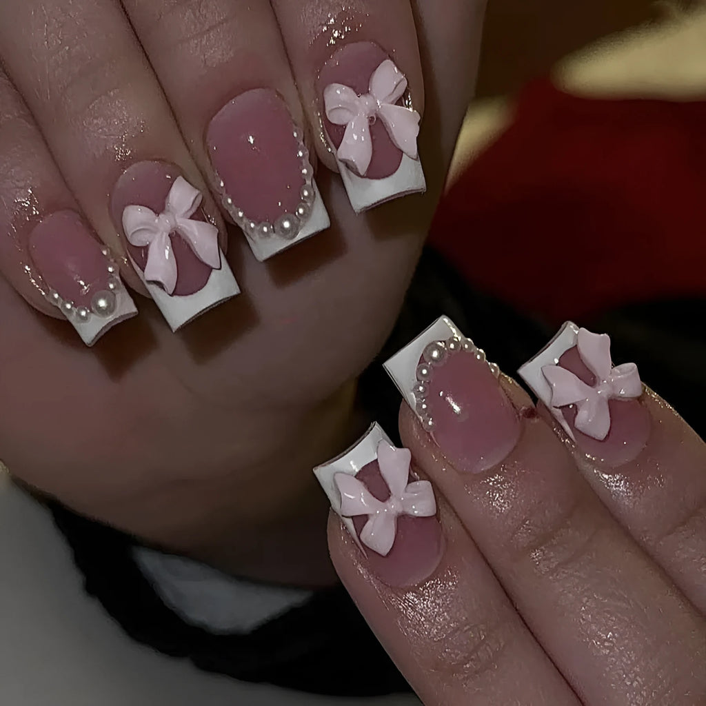 Short white square false nails with bow French manicure design and tulip patterns