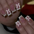 Short white square false nails with bow French manicure design and tulip patterns