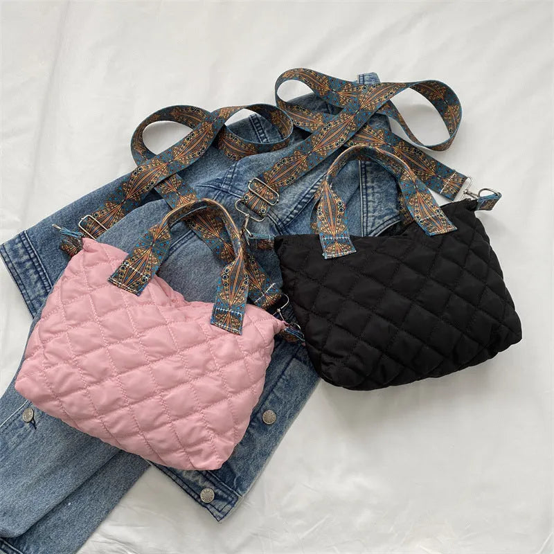 Oxford cloth messenger bag in horizontal square shape with single shoulder strap and sandwich pocket