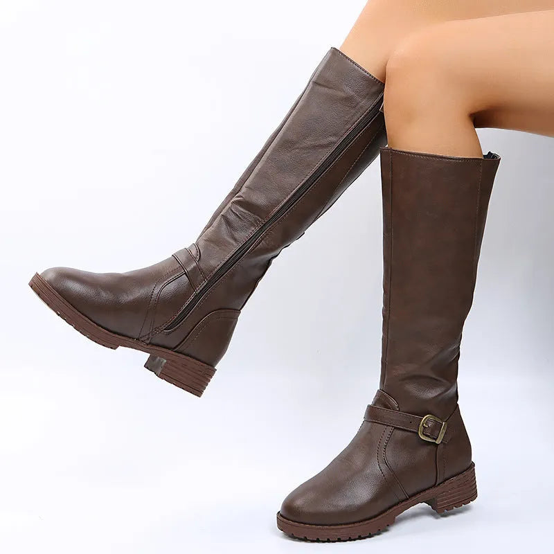 Women's black knight boots with square heel, round toe, and high shaft featuring belt buckle detail