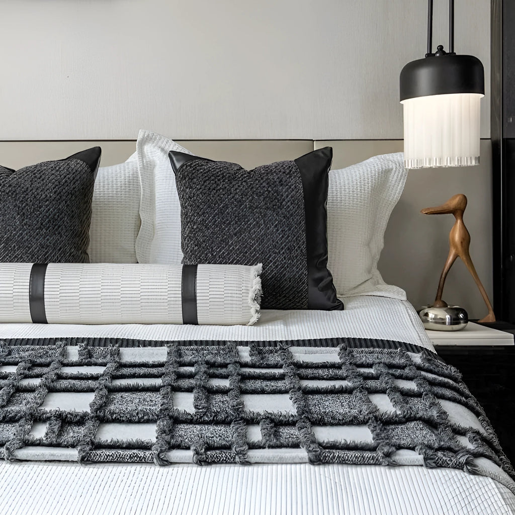 Modern minimalist polyester bed runner blanket set with round pillow and pillowcase on a bed.
