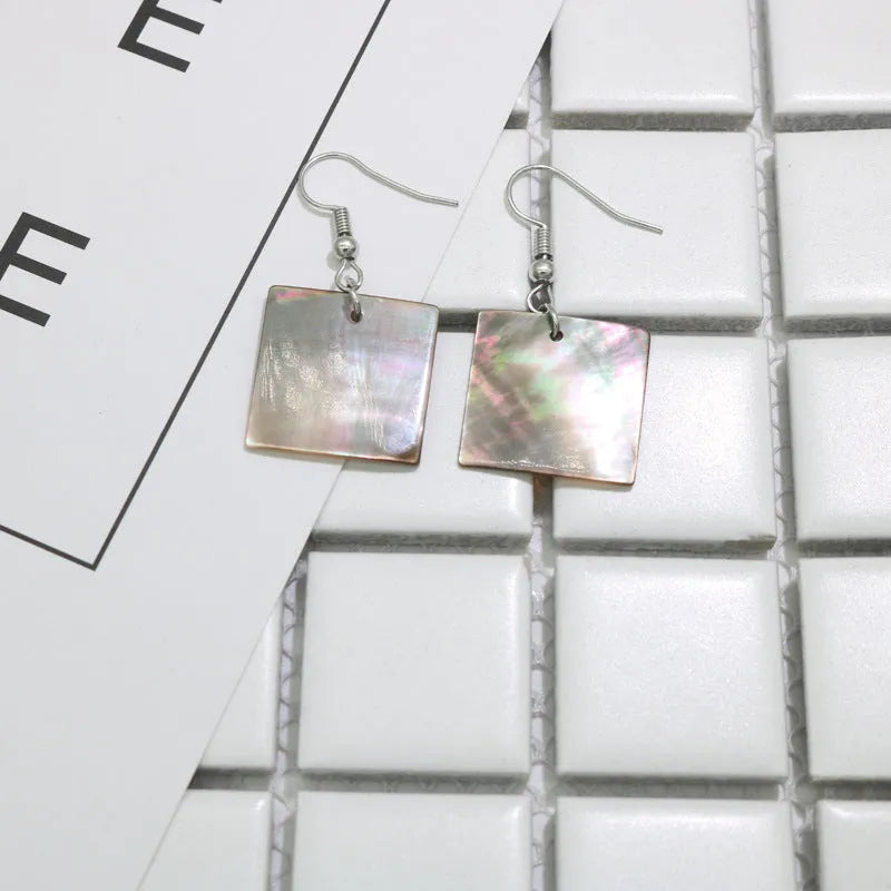 Geometric shell earrings in square and rectangular shapes with sterling silver hooks