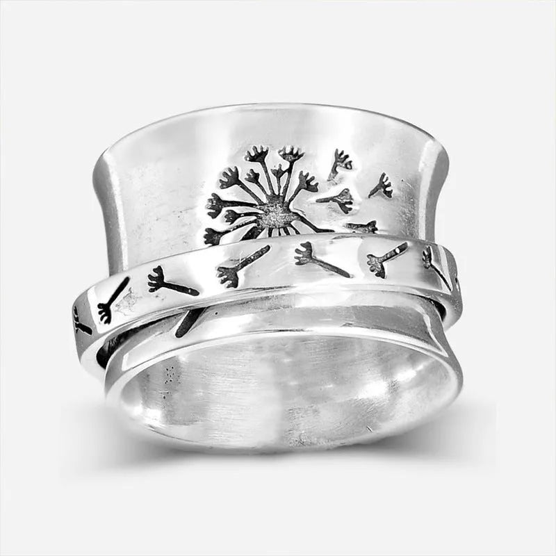 Silver rotatable flower ring showing spinning petals on alloy band