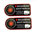 Pair of black and white electrostatic warning stickers for Tesla sentry mode, sized 11cm by 5cm.