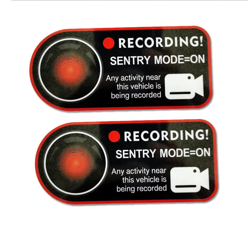 Pair of black and white electrostatic warning stickers for Tesla sentry mode, sized 11cm by 5cm.