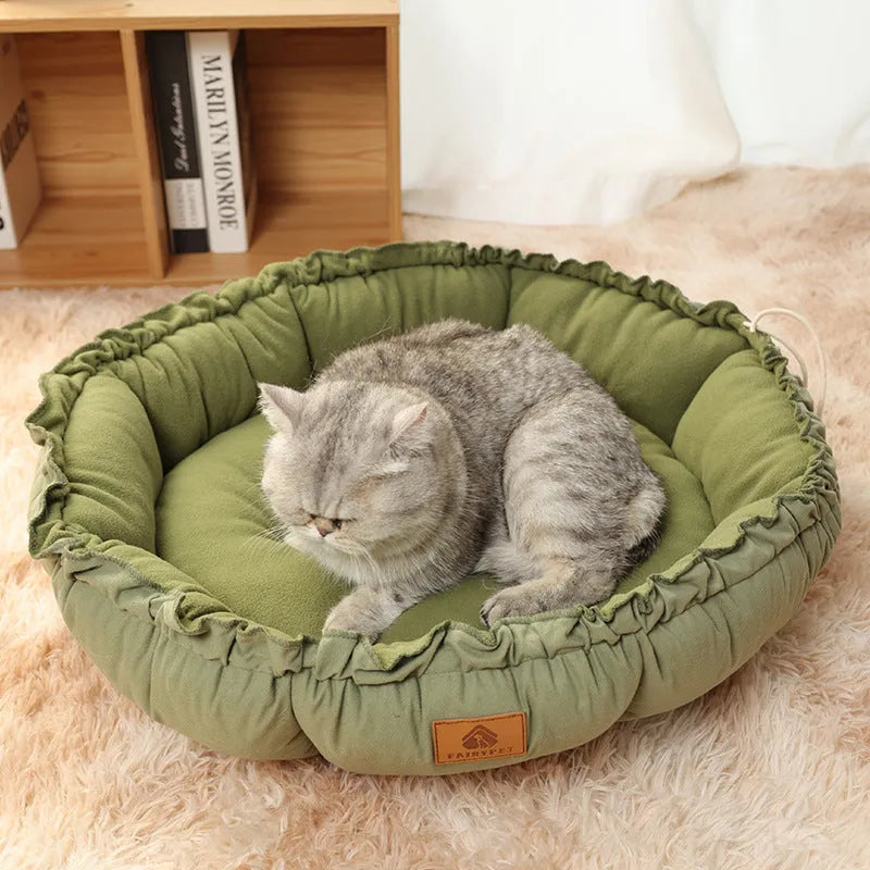 Grey and green reversible donut pet bed for cats and dogs with high sides.