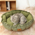 Grey and green reversible donut pet bed for cats and dogs with high sides.