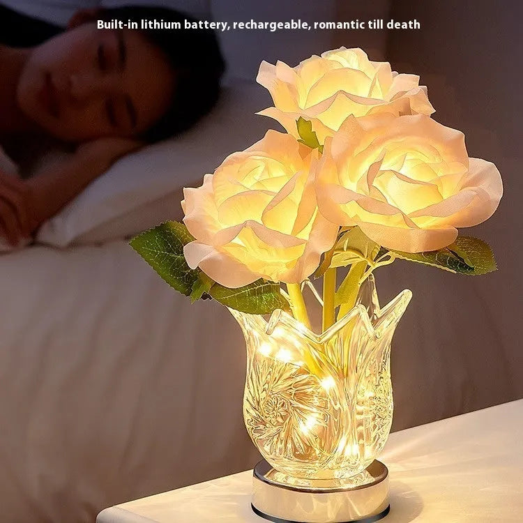 Modern clear crystal flowers USB rechargeable table lamp with touch dimming control on a wooden surface.