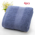 Thickened cotton blend bath and beach towel shown in multiple colour options including green, blue, and pink variations.