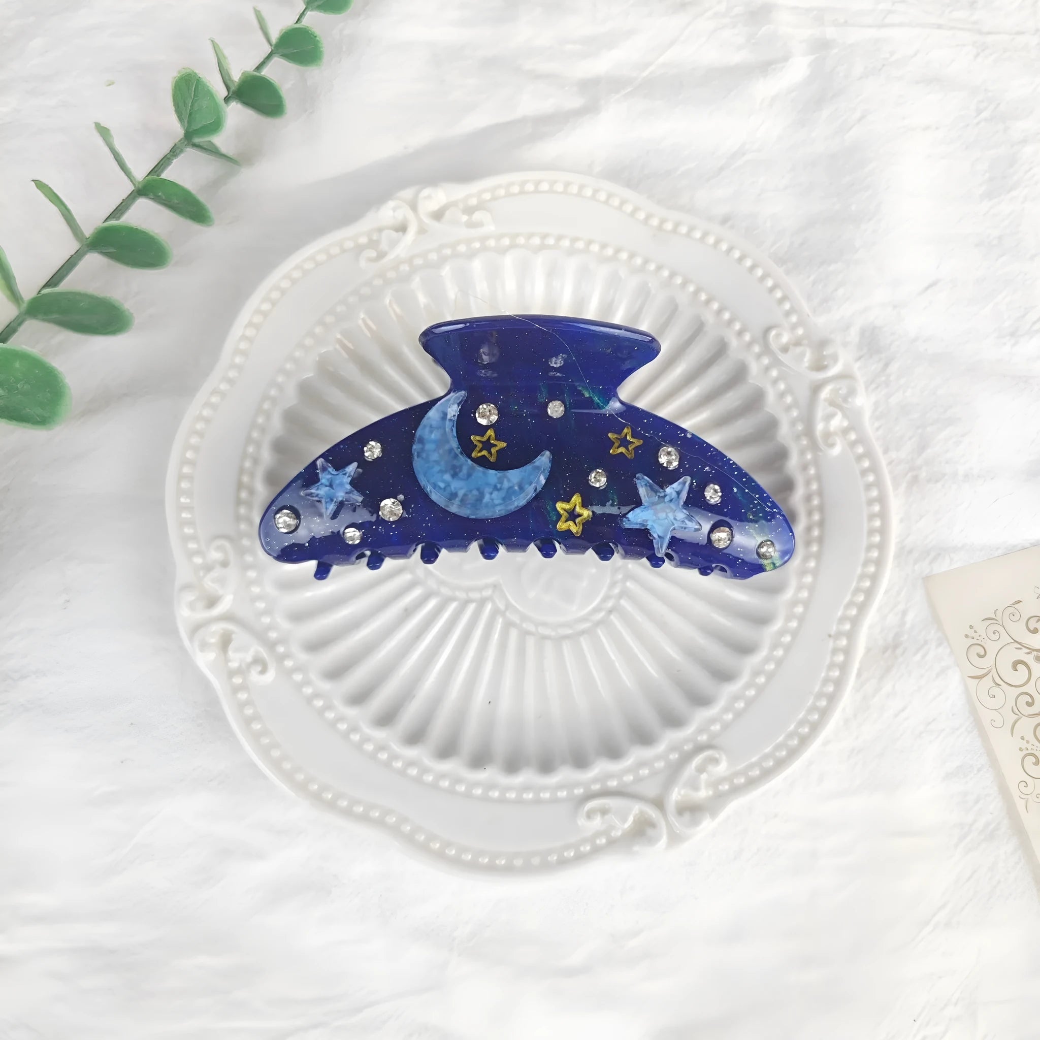 Oversized starry sky pattern hair barrette in cellulose acetate, shown in a choice of colours.