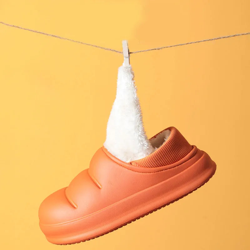 Waterproof EVA garden slippers in green with a plush lining and non-slip sole.