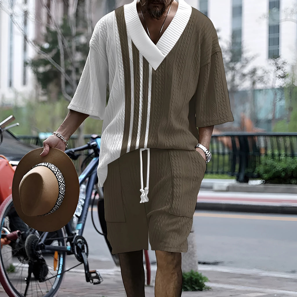Man wearing a printed drop-shoulder knitted short-sleeve top with matching shorts, a casual summer suit set.