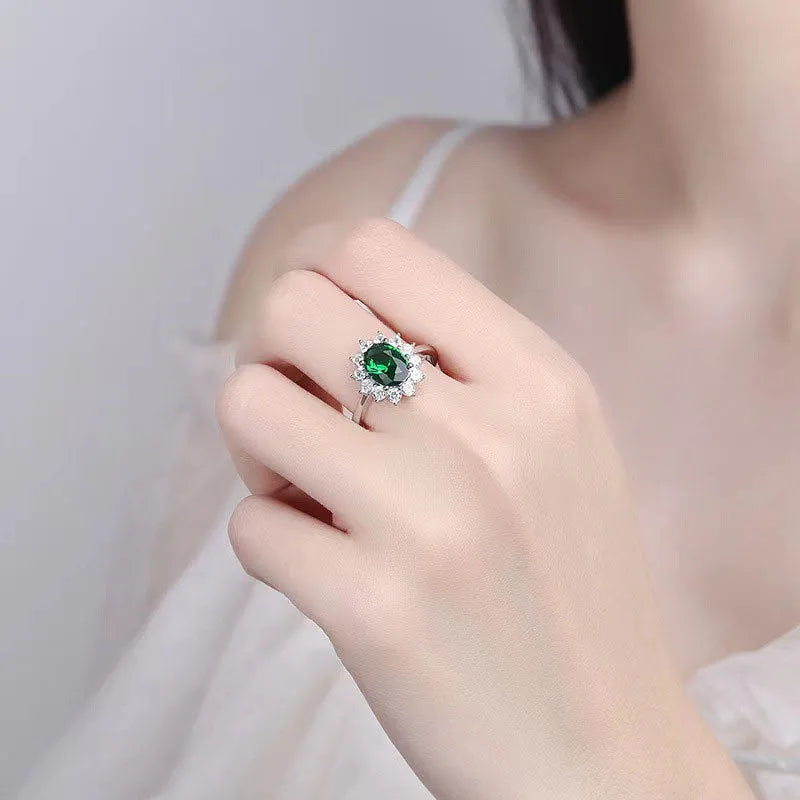 Women's blue moissanite flower ring in electroplated copper with inlaid zirconium, shown in green, blue, or red.