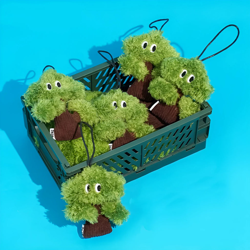 Pine tree-shaped cat chew toy with a dangling pendant, shown in three sizes.