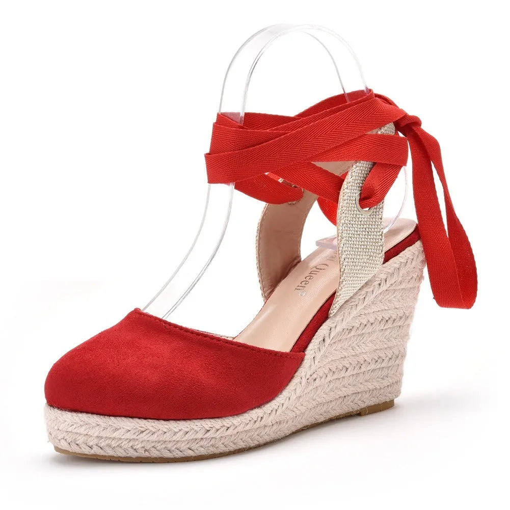 Women's apricot bohemian wedge sandals with beaded tassel detail on embossed strap.