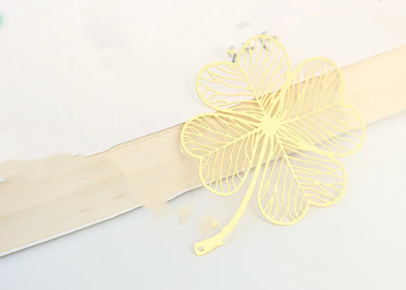 Brass metal hollow plated bookmark with leaf design and rose gold tassel