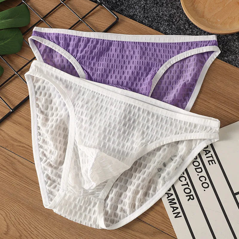 Men's low waist lace underwear in black on a white background