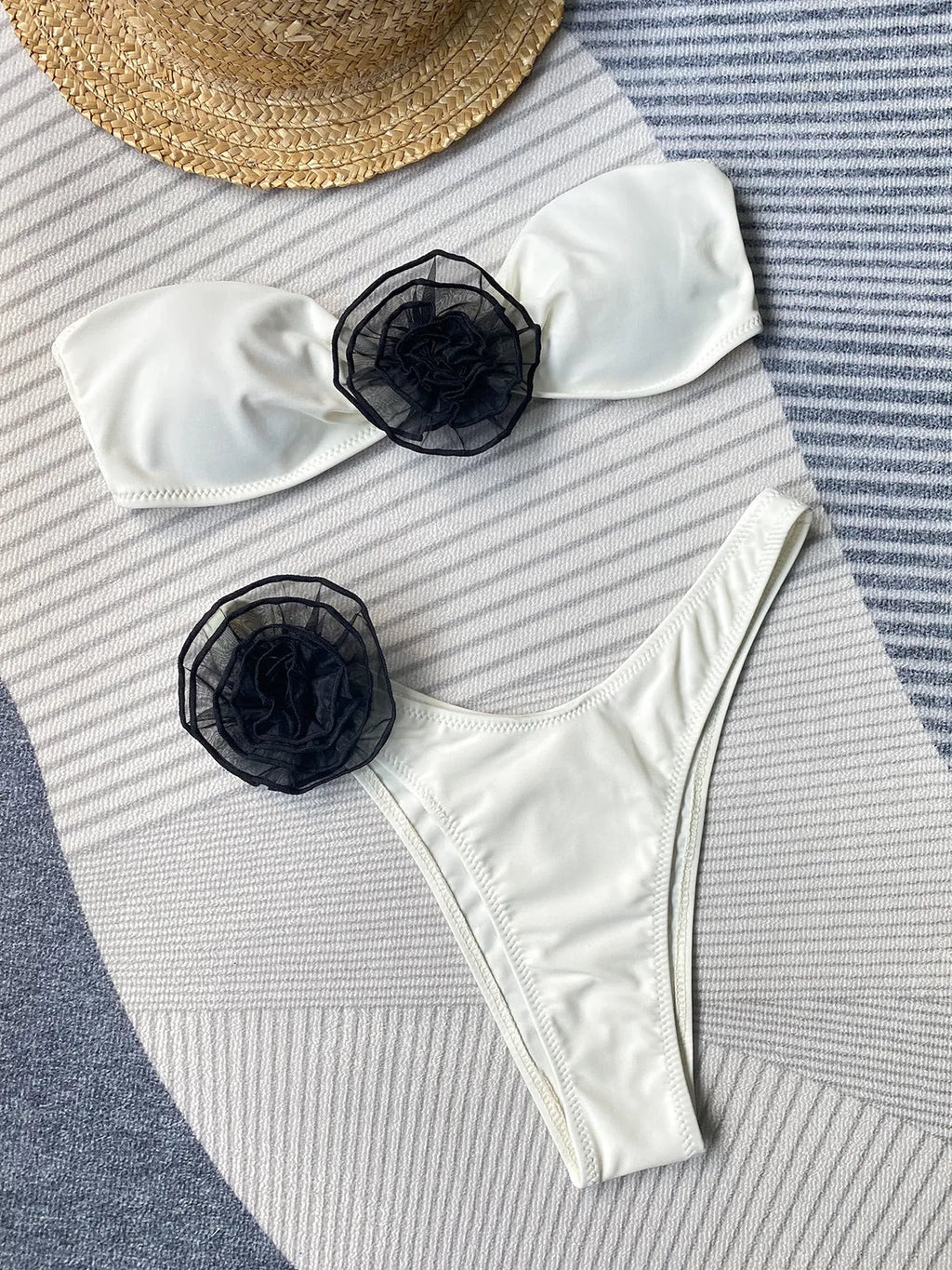 A striped women's cross-back bikini with a floral split design on the briefs.