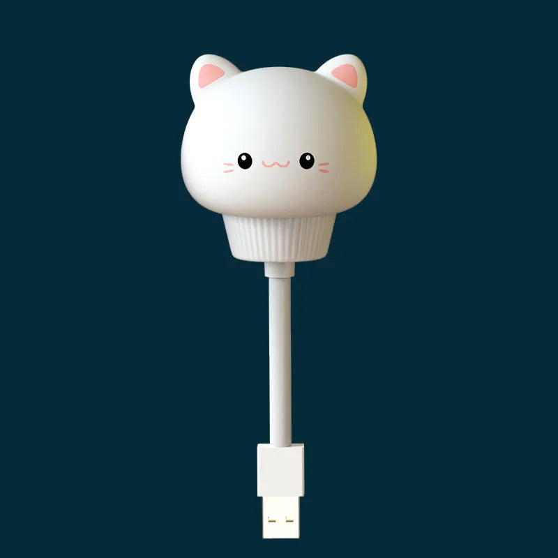 Cartoon animal USB night light in bear shape with remote control on a bedside table