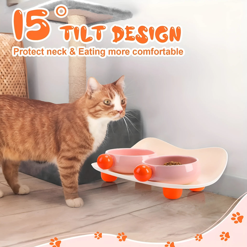 Two ceramic pet bowls on raised non-slip bases, in pink and yellow colours.