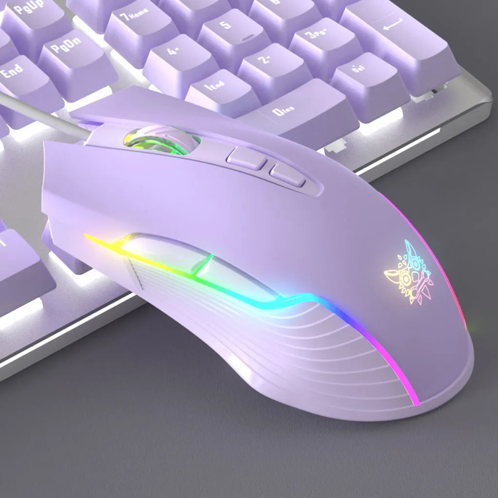 Purple mechanical keyboard and white mouse set with backlighting on wooden desk