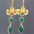 Gold coloured retro earrings with water drop zircon stones and French leaves tassel detail.