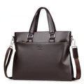 Men's black PU leather business messenger bag with spliced design shown from the side.