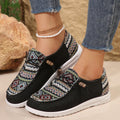 Women's black round toe low-top flat shoes with artificial PU upper and rubber sole on a white background