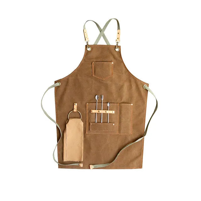 Canvas apron with cross strap back design in camel colour for baking and gardening protection