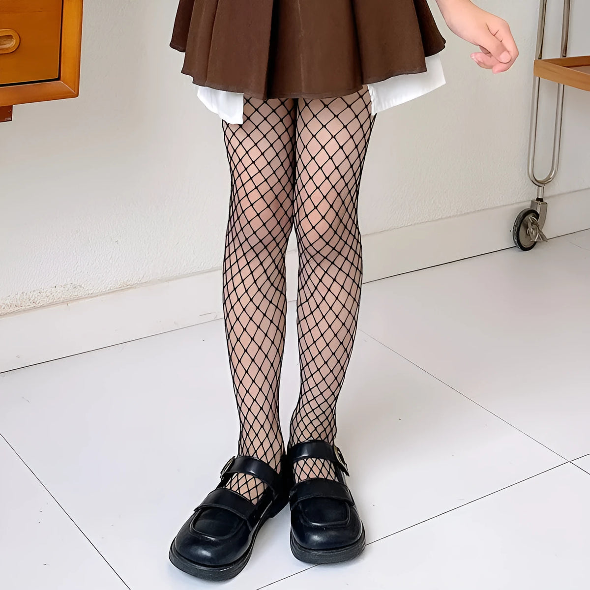 Women's black and white mesh stockings showing large, medium, and small net patterns on a leg.