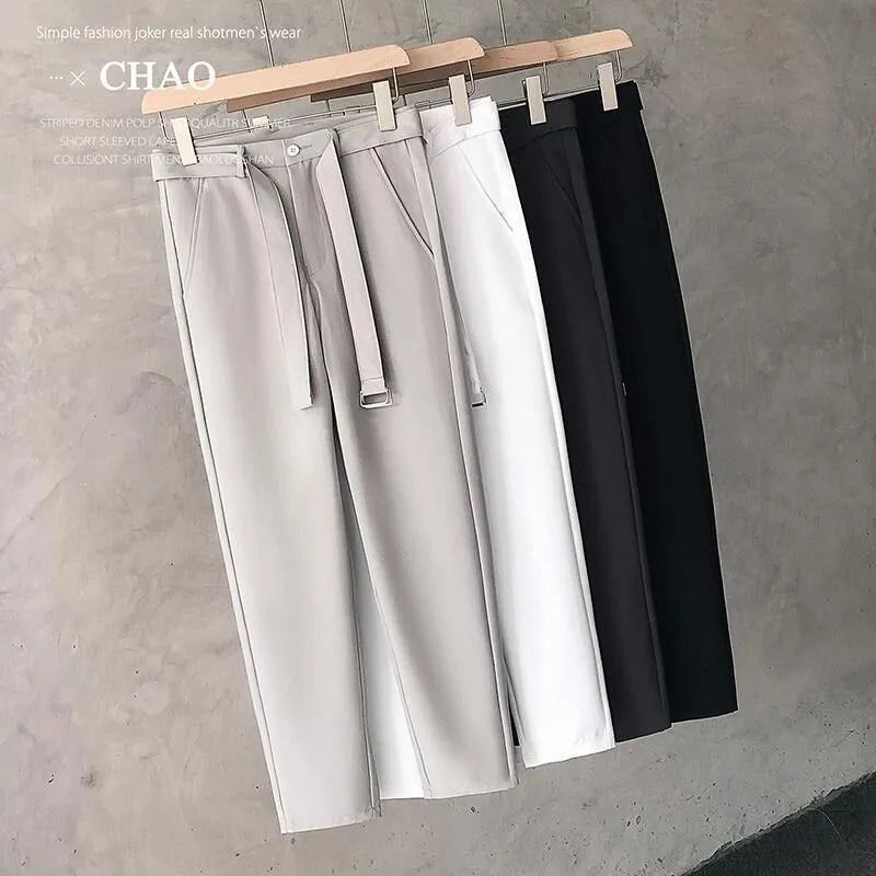Boys slim straight trousers in wool blend fabric on a hanger, showing tapered leg